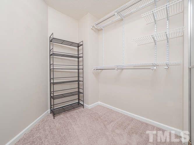 5520 Edgebury Road Raleigh, NC 27613 - Photo 18 of 29 a view of walk in closet with empty racks
