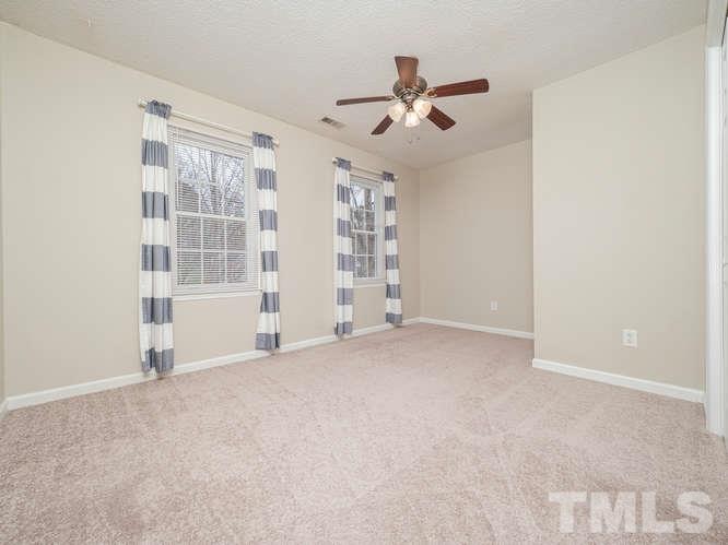 5520 Edgebury Road Raleigh, NC 27613 - Photo 19 of 29 a view of an empty room with a window