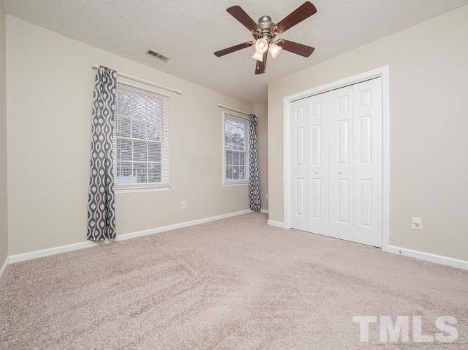 5520 Edgebury Road Raleigh, NC 27613 - Photo 20 of 29 an empty room with windows and fan