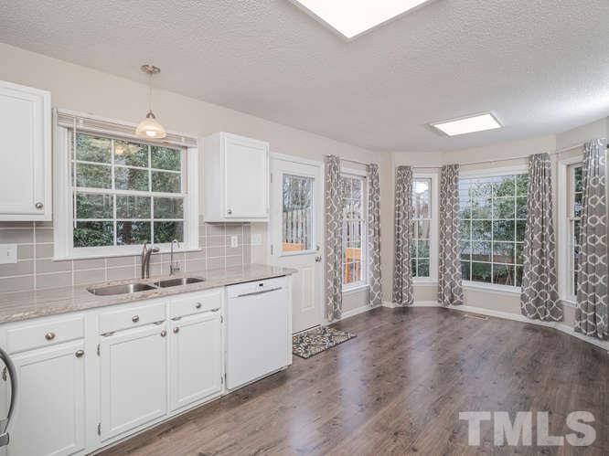 5520 Edgebury Road Raleigh, NC 27613 - Photo 3 of 29 a kitchen with a sink and large window