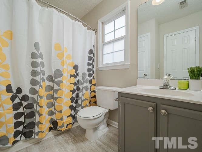 5520 Edgebury Road Raleigh, NC 27613 - Photo 21 of 29 a bathroom with a sink toilet and shower