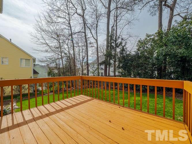 5520 Edgebury Road Raleigh, NC 27613 - Photo 22 of 29 a view of balcony with wooden floor and fence