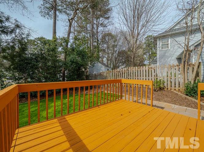5520 Edgebury Road Raleigh, NC 27613 - Photo 23 of 29 a view of balcony with wooden floor and fence