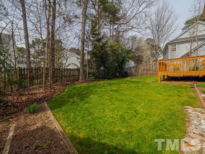 5520 Edgebury Road Raleigh, NC 27613 - Photo 24 of 29 a view of a yard with large trees