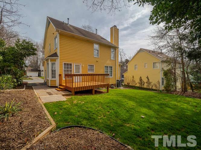 5520 Edgebury Road Raleigh, NC 27613 - Photo 25 of 29 a view of a house with a yard