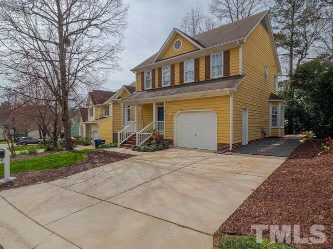 5520 Edgebury Road Raleigh, NC 27613 - Photo 27 of 29 a front view of a house with a yard and garage