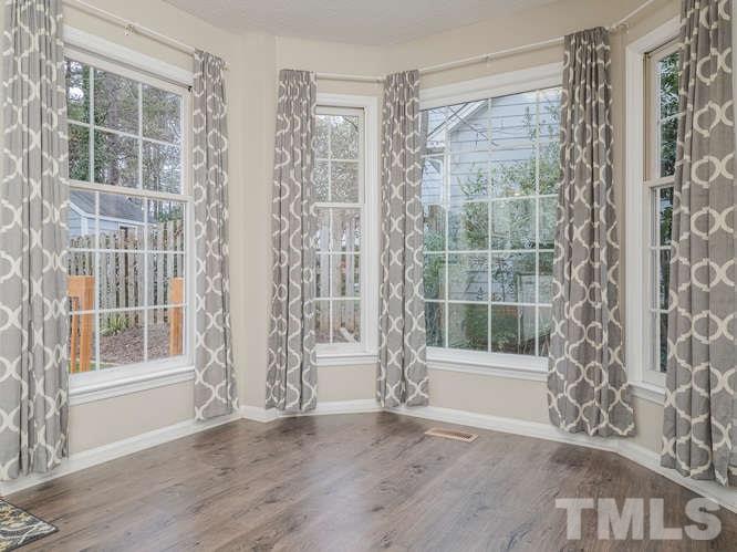 5520 Edgebury Road Raleigh, NC 27613 - Photo 7 of 29 a view of front door with wooden floor and a window