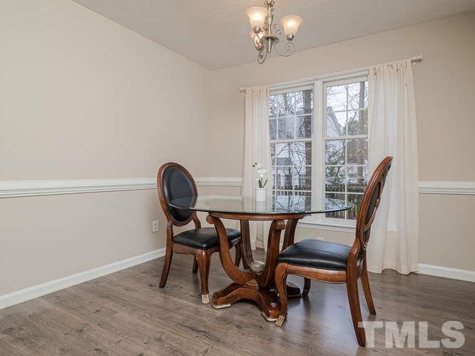 5520 Edgebury Road Raleigh, NC 27613 - Photo 9 of 29 a view of a dining room with furniture window and wooden floor