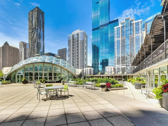 a swimming pool with outdoor seating and yard