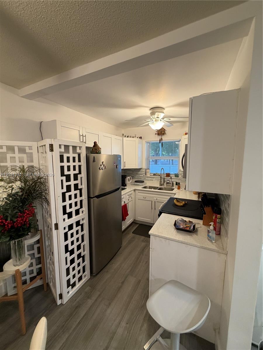 3500 Harrison Street, Unit 4 Hollywood, FL 33021 - Photo 3 of 10 a kitchen with refrigerator and stove