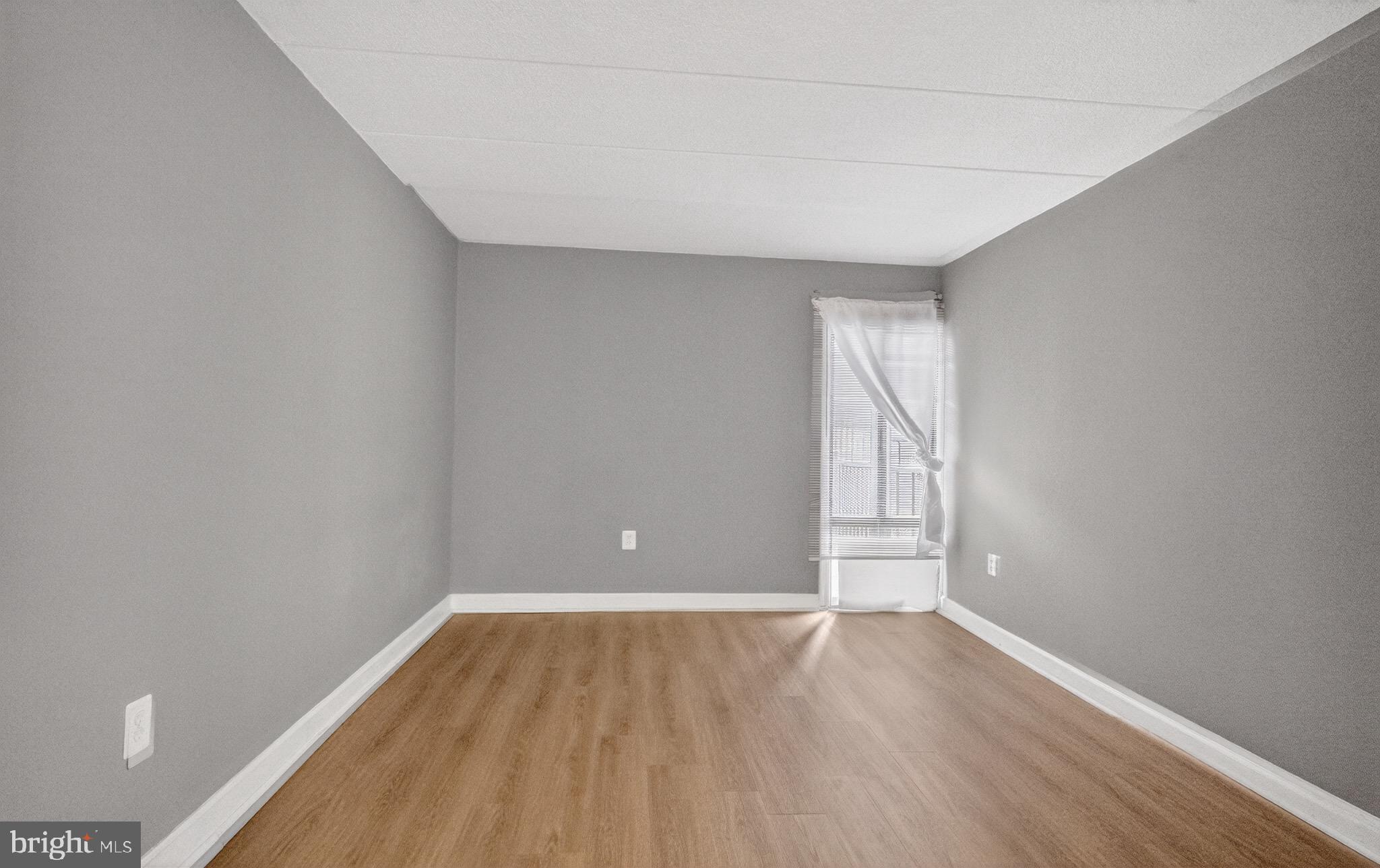 3301 Hewitt Avenue, Unit 403 Silver Spring, MD 20906 - Photo 13 of 19 a view of empty room with wooden floor