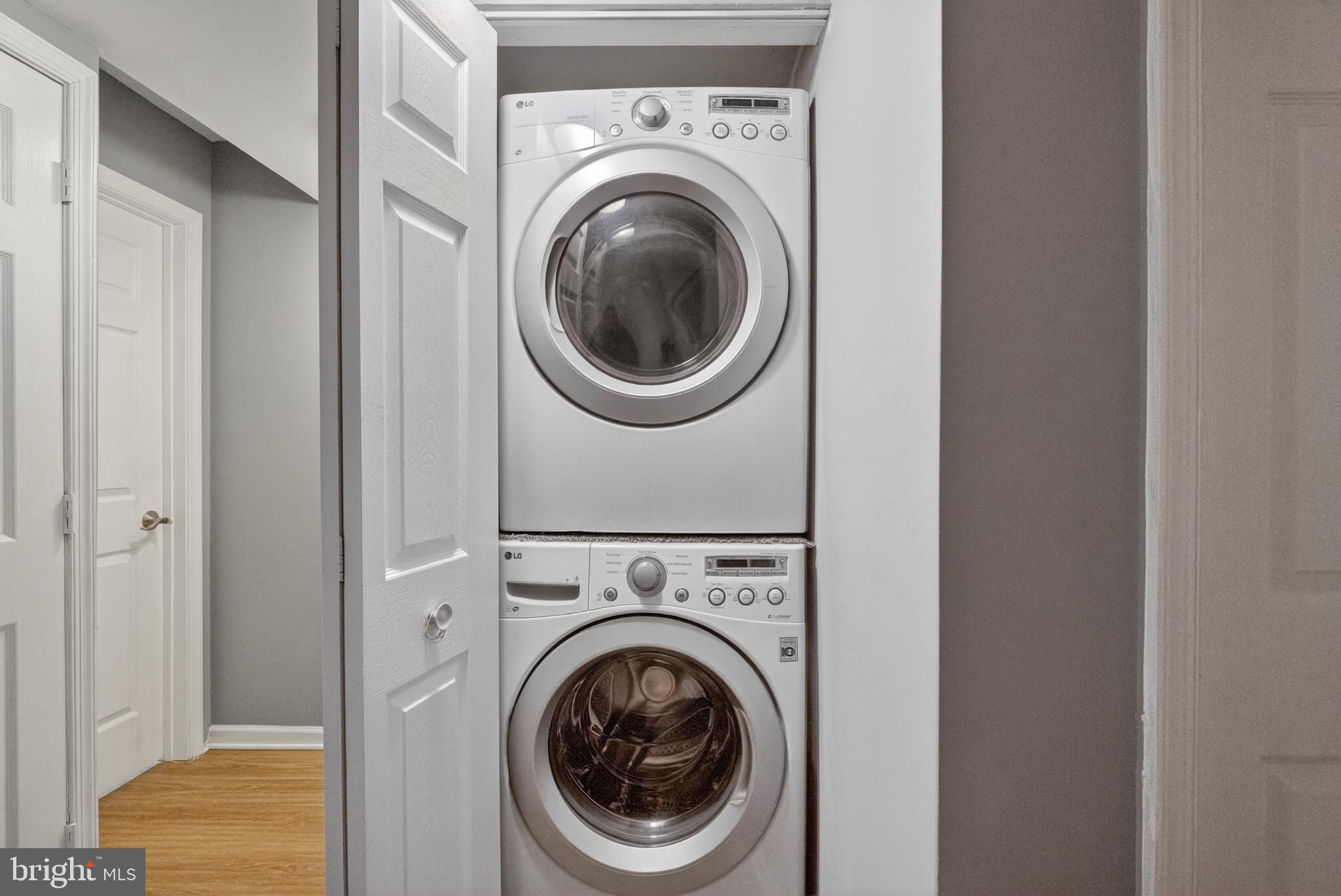 3301 Hewitt Avenue, Unit 403 Silver Spring, MD 20906 - Photo 8 of 19 a view of a hallway with washer and dryer