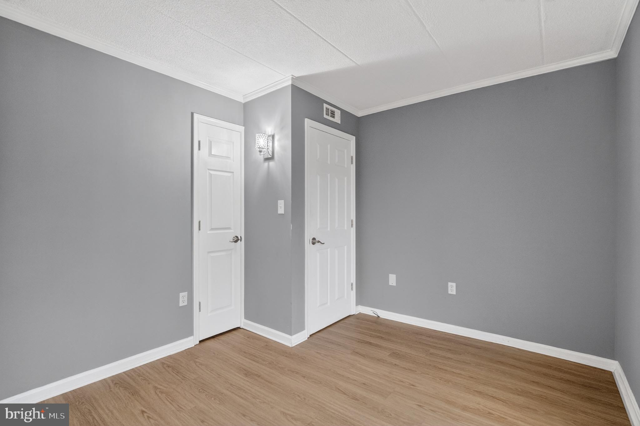 3301 Hewitt Avenue, Unit 403 Silver Spring, MD 20906 - Photo 9 of 19 a view of an empty room with wooden floor