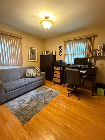a living room with furniture rug and window