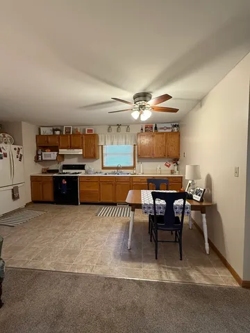 a view of a kitchen and dining room