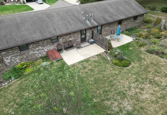a view of a backyard with table and chairs
