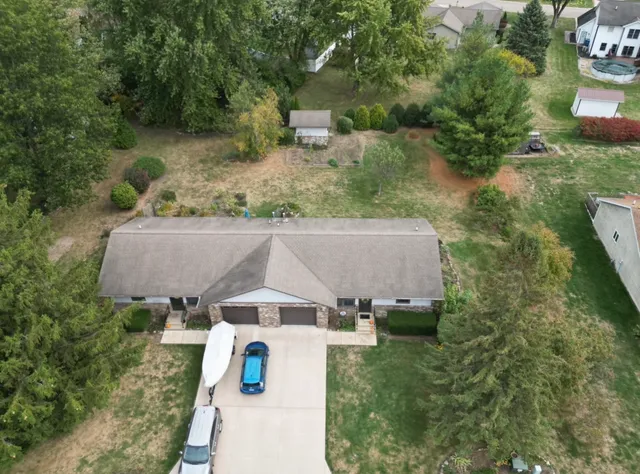 an aerial view of a house with outdoor space
