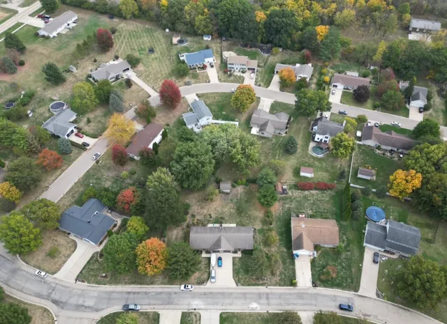 an aerial view of residential houses with outdoor space
