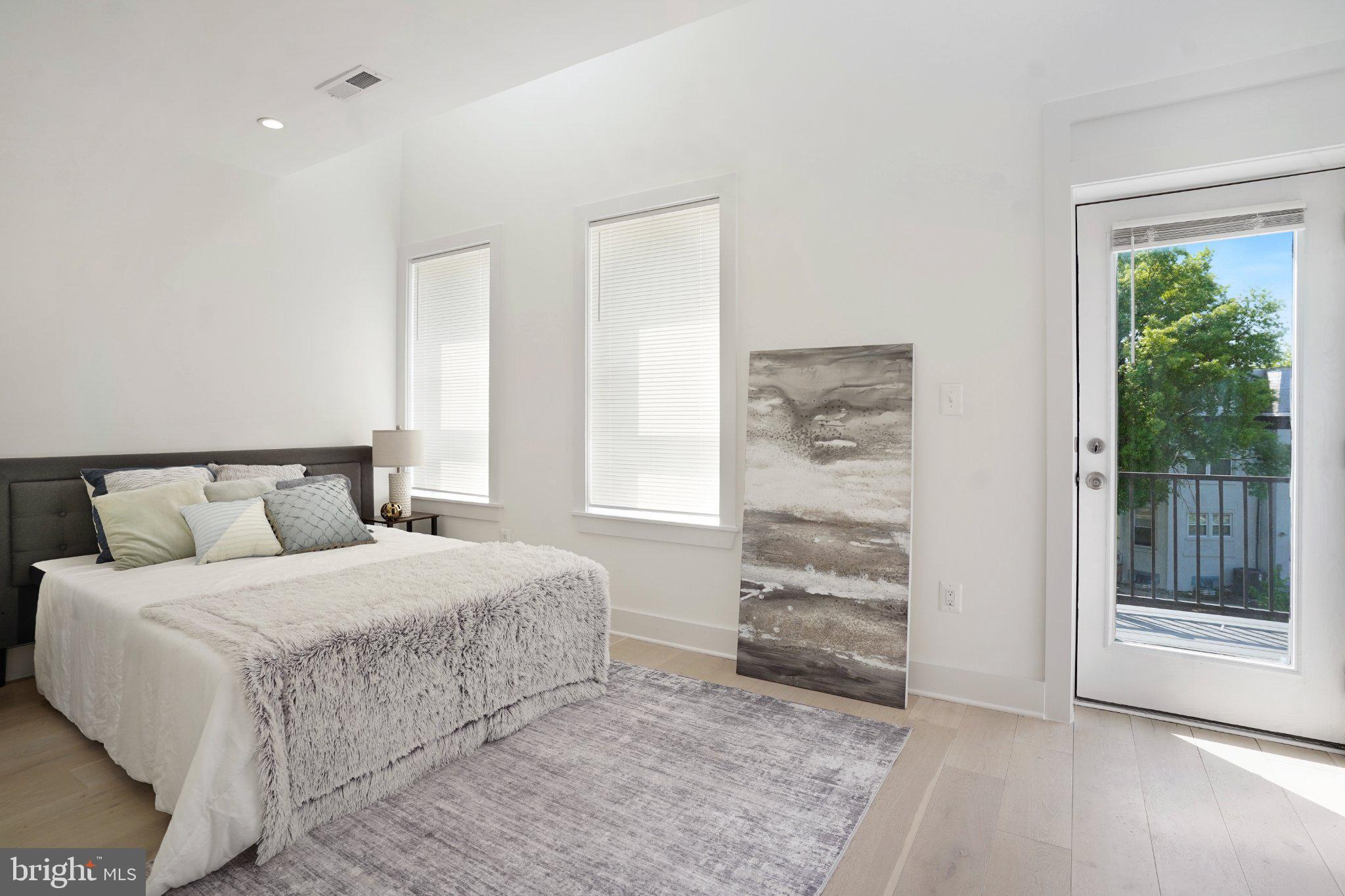 112 V Street Northeast Washington, DC 20002 - Photo 21 of 25 a bedroom with a bed and a window