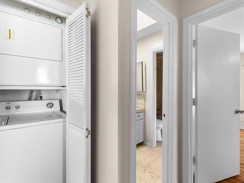 4110 Travis Street, Unit E Dallas, TX 75204 - Photo 22 of 23 a view of utility room with washer and dryer