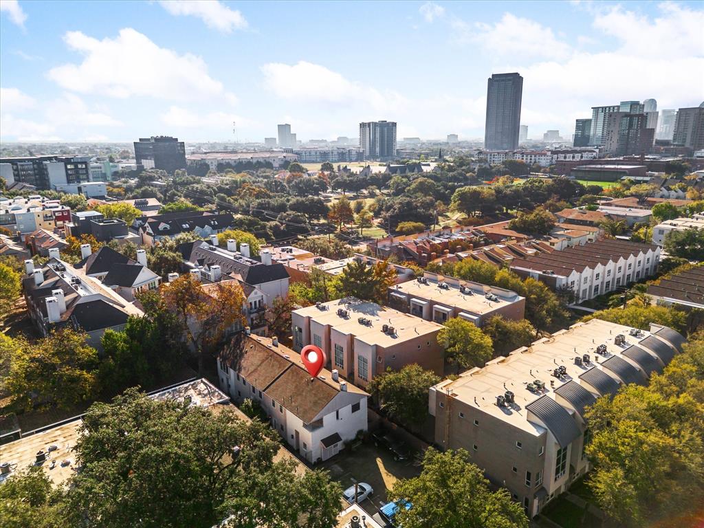 4110 Travis Street, Unit E Dallas, TX 75204 - Photo 3 of 23 an aerial view of a city with lots of residential buildings