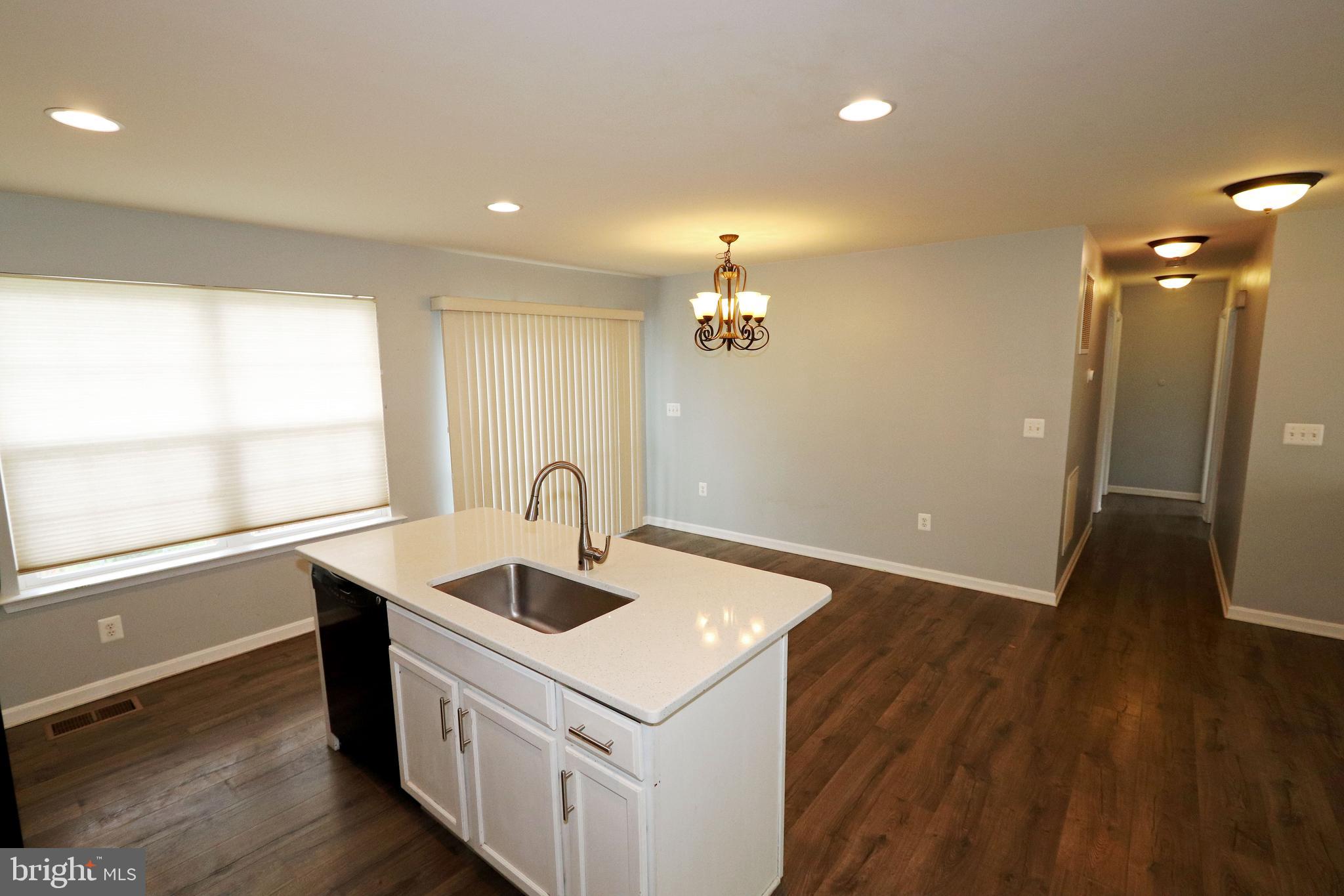 95 Mason Road Prince Frederick, MD 20678 - Photo 9 of 40 Kitchen, dining and hallway to bedrooms