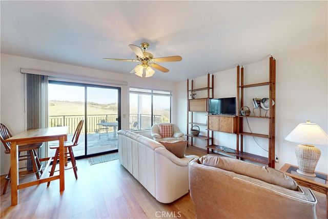 a view of a chairs and table in the patio