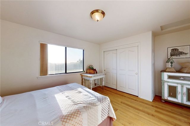 an aerial view of houses with a yard