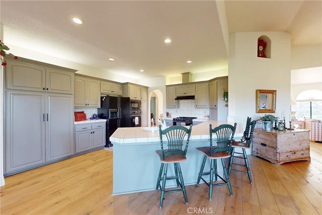 a kitchen with lots of counter top space and dining table