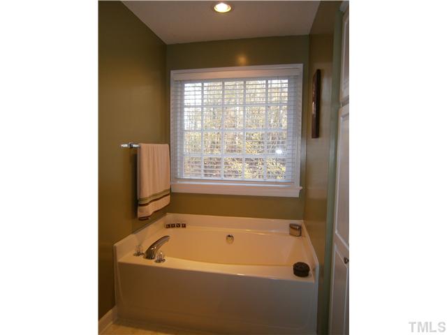 2124 Virginia Dare Place Raleigh, NC 27610 - Photo 15 of 25 Large Garden tub, Separate Oversized Shower. Tons of Cabinetry for storage.