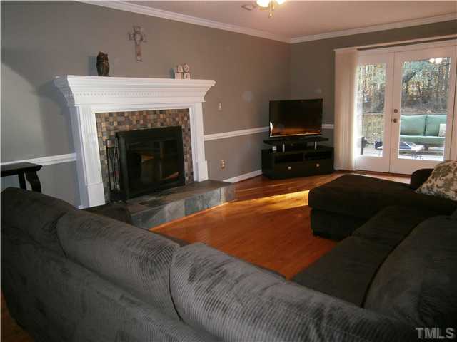 2124 Virginia Dare Place Raleigh, NC 27610 - Photo 6 of 25 Very spacious, Couch negotiable, French Doors open to Deck.