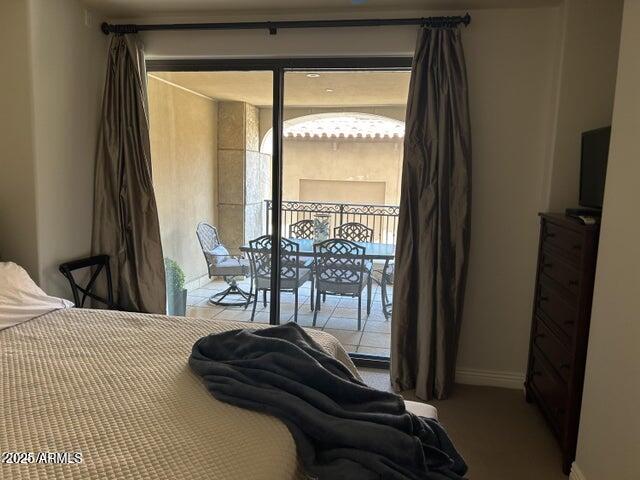 7181 East Camelback Road, Unit 201 Scottsdale, AZ 85251 - Photo 7 of 15 a bedroom with a bed and a large window