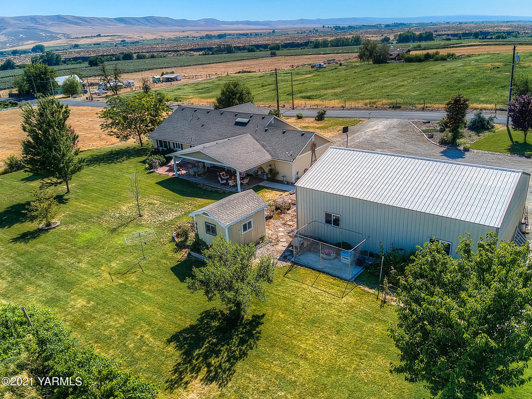 611 County Line Road Prosser, WA 99350 - Photo 22 of 23 an aerial view of a house with garden space and outdoor seating
