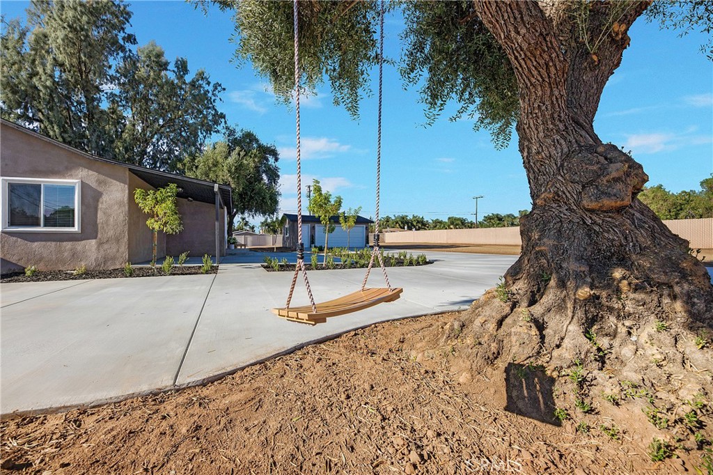 16524 Washington Street Riverside, CA 92504 - Photo 1 of 1 Enter fenced yard on driveway.
