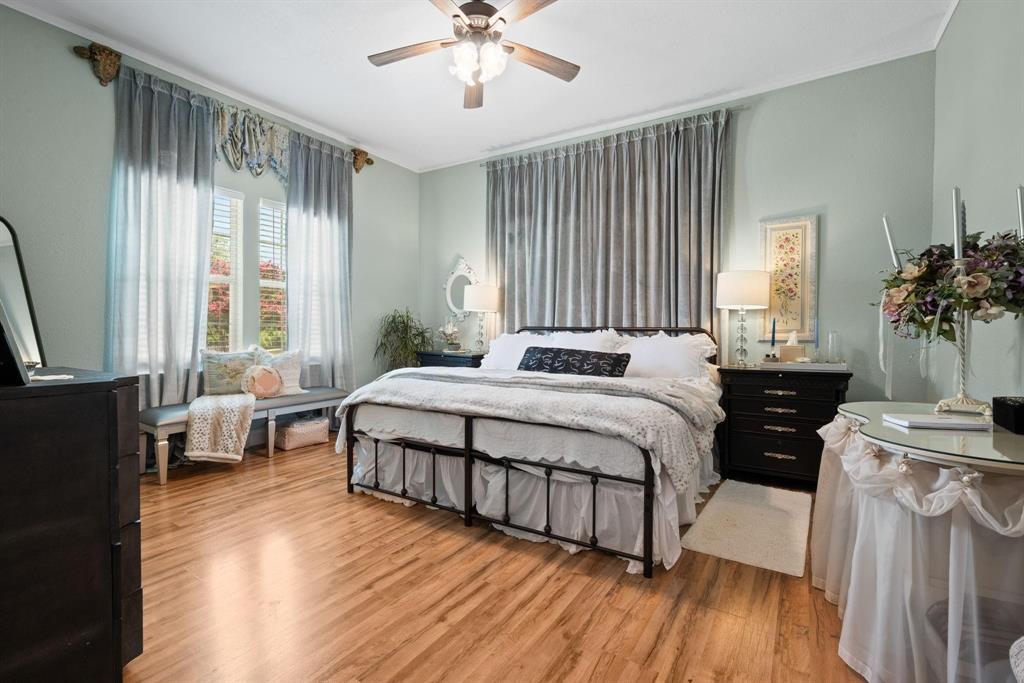 809 Southwest 5th Avenue Mineral Wells, TX 76067 - Photo 12 of 18 a bedroom with a bed and a chandelier