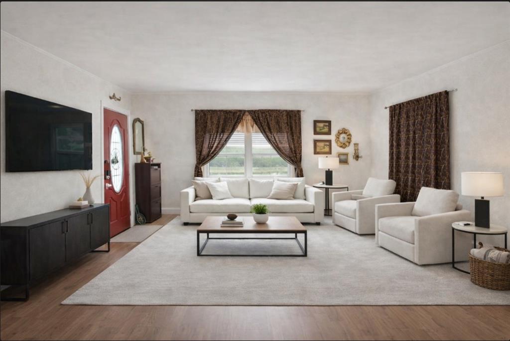 809 Southwest 5th Avenue Mineral Wells, TX 76067 - Photo 3 of 18 a living room with furniture and a flat screen tv