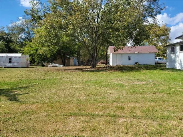 a view of a house with a small yard