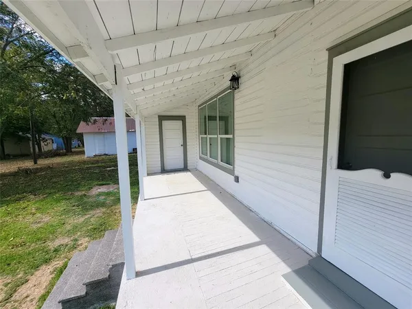 a view of a porch with a backyard