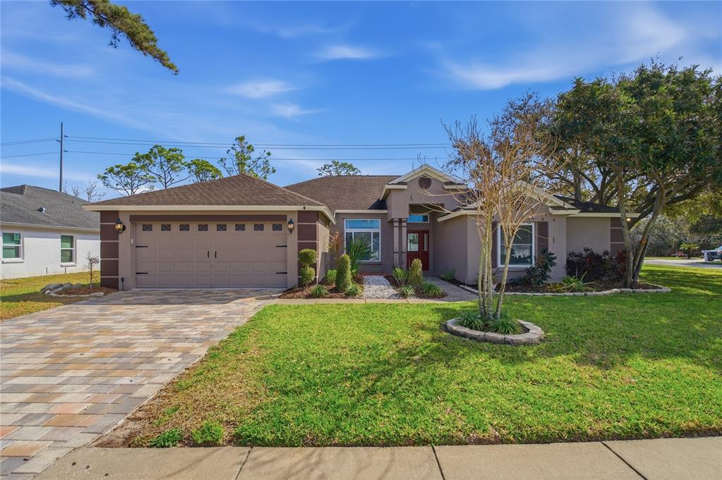 17431 Isbell Lane Odessa, FL 33556 - Photo 1 of 47 a front view of a house with a yard