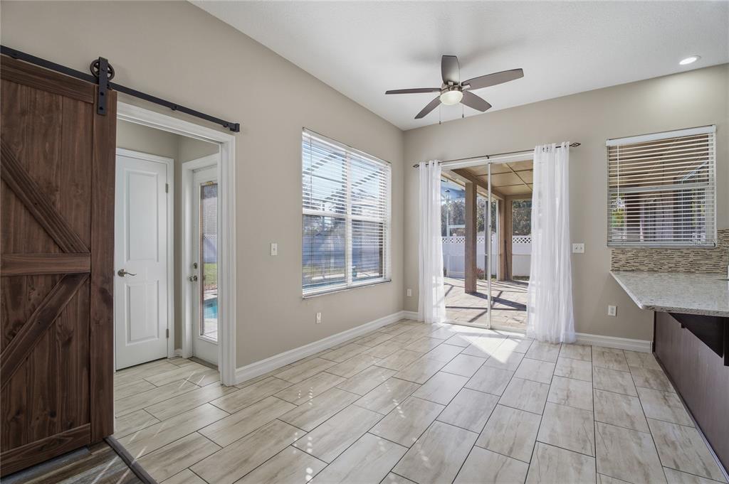 17431 Isbell Lane Odessa, FL 33556 - Photo 19 of 47 a view of kitchen with sink cabinets and outdoor space