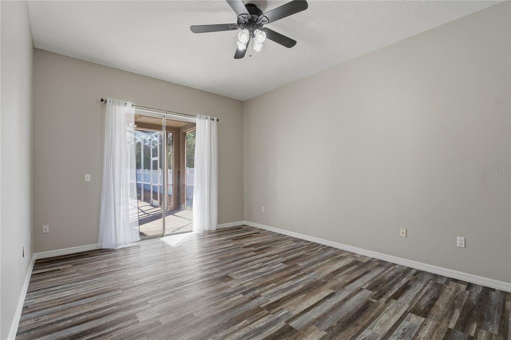 17431 Isbell Lane Odessa, FL 33556 - Photo 20 of 47 wooden floor in an empty room with a window