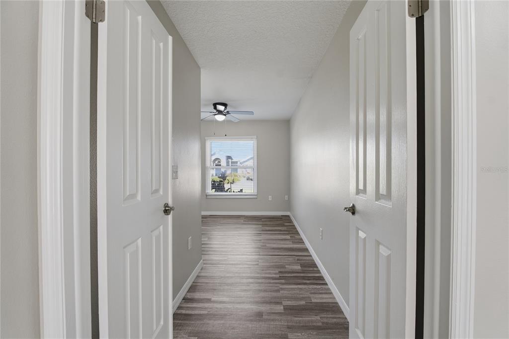 17431 Isbell Lane Odessa, FL 33556 - Photo 25 of 47 a view of a hallway with a wooden door