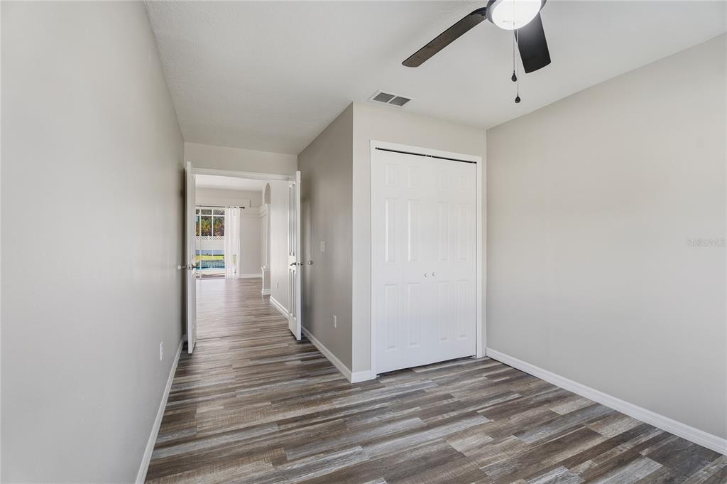 17431 Isbell Lane Odessa, FL 33556 - Photo 26 of 47 a view of a hallway with wooden floor and entryway