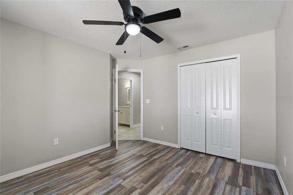 17431 Isbell Lane Odessa, FL 33556 - Photo 30 of 47 wooden floor in an empty room