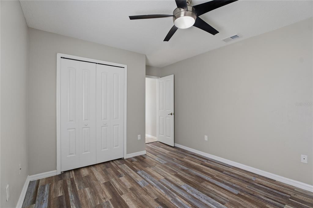 17431 Isbell Lane Odessa, FL 33556 - Photo 34 of 47 wooden floor in an empty room