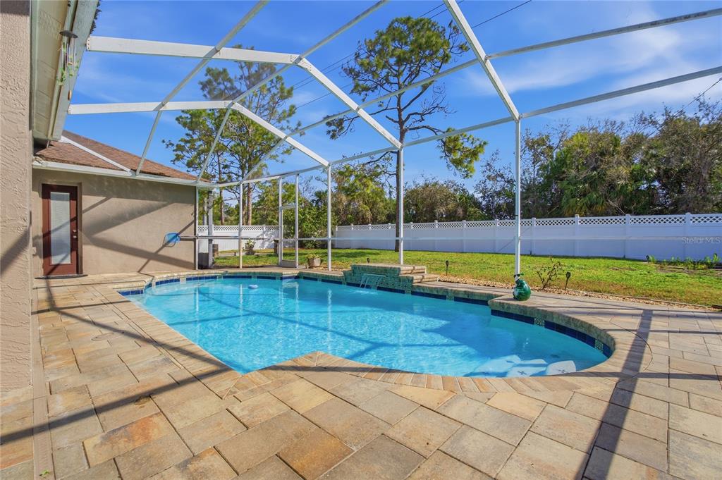 17431 Isbell Lane Odessa, FL 33556 - Photo 38 of 47 a view of a backyard with a swimming pool