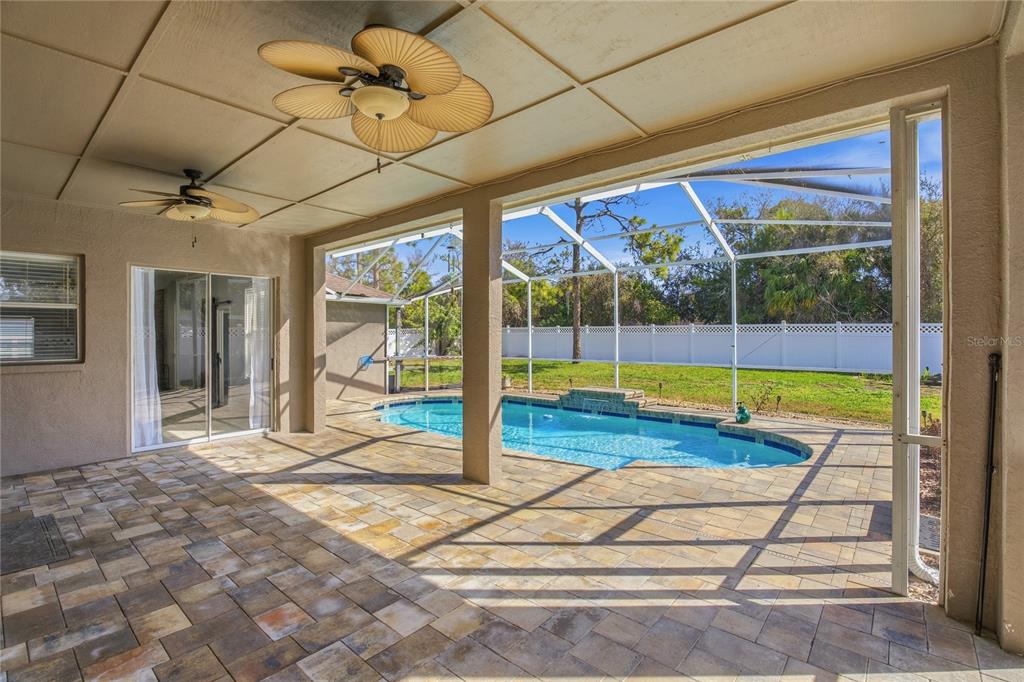 17431 Isbell Lane Odessa, FL 33556 - Photo 40 of 47 a view of a room with wooden floor and floor to ceiling windows