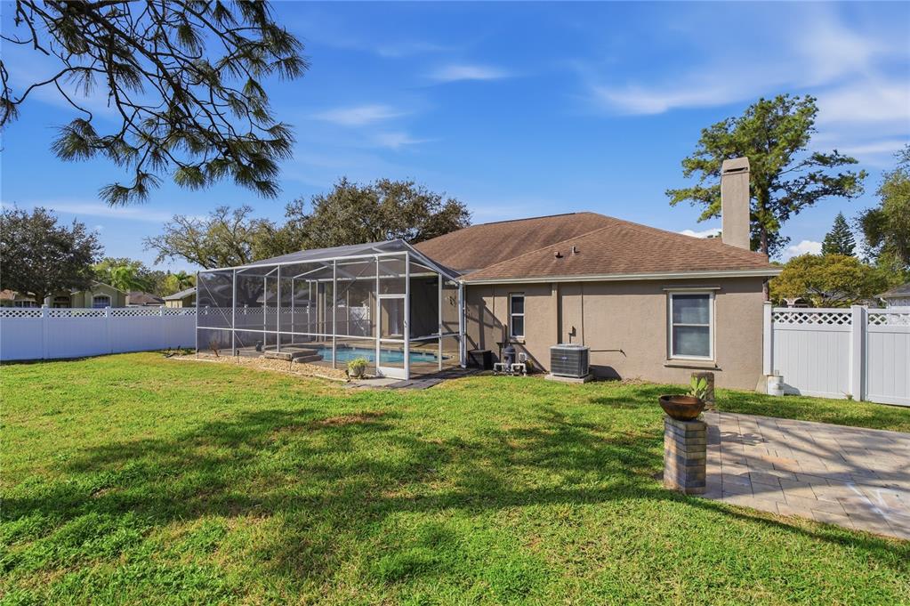 17431 Isbell Lane Odessa, FL 33556 - Photo 43 of 47 a view of a house with a yard porch and sitting area