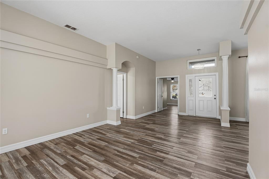 17431 Isbell Lane Odessa, FL 33556 - Photo 5 of 47 a view of an empty room with wooden floor
