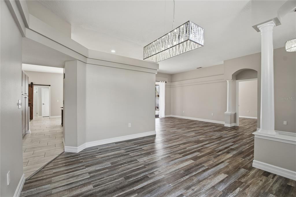 17431 Isbell Lane Odessa, FL 33556 - Photo 7 of 47 a view of a livingroom with wooden floor